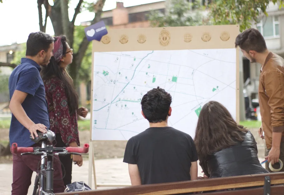 Neighbours gathering around the participatory map